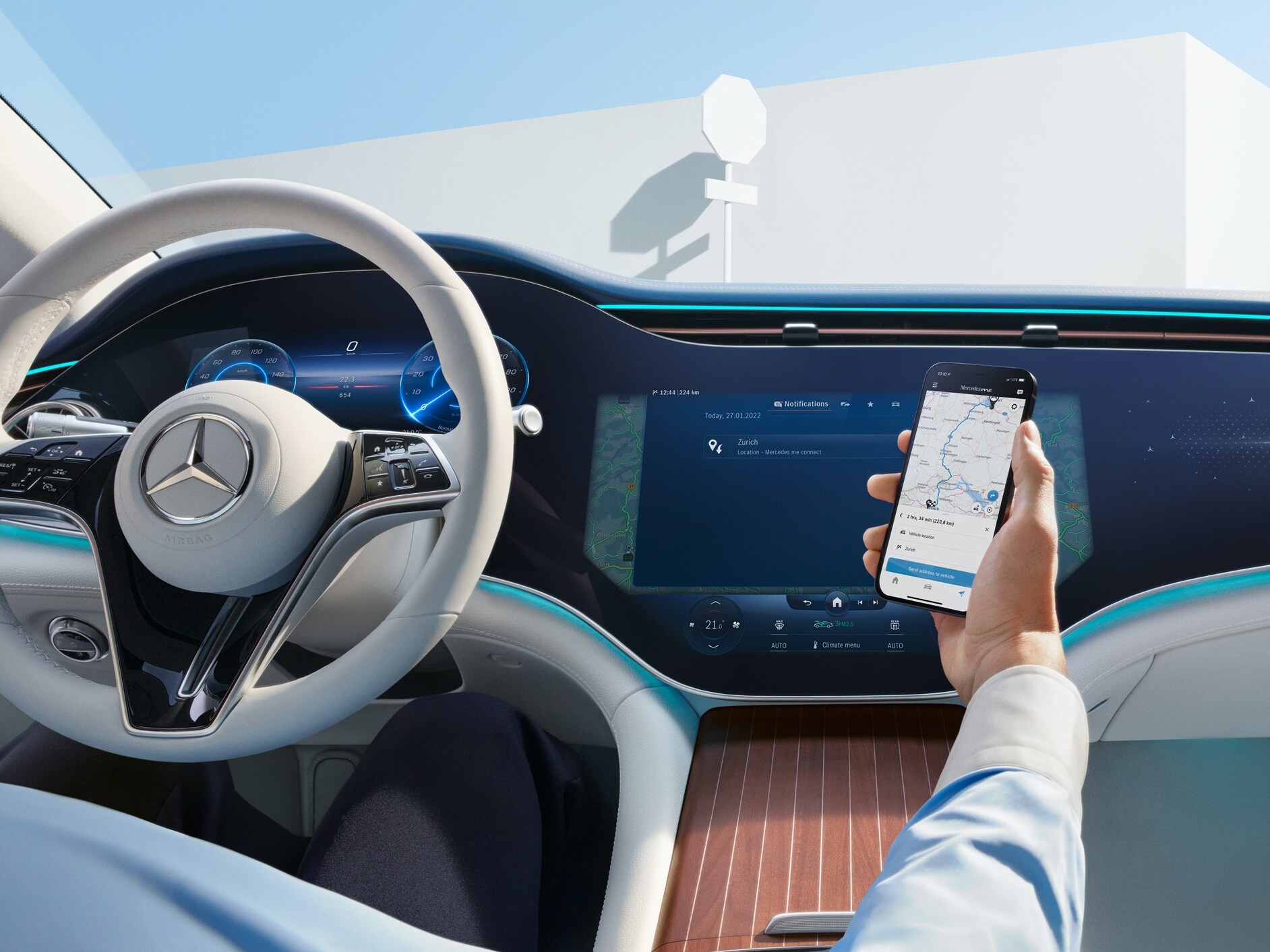 A man in the driver's seat connecting his mobile phone to his vehicle to use the Digital Extras.