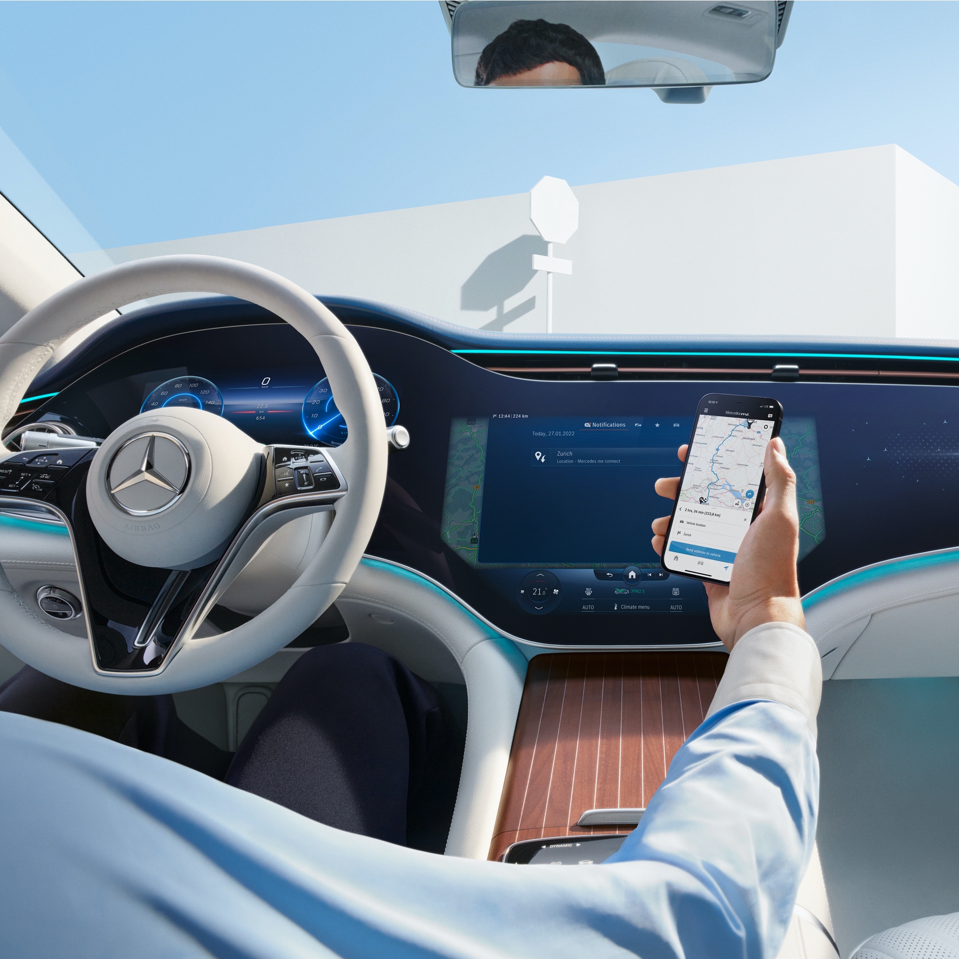 A man in the driver's seat connecting his mobile phone to his vehicle to use the Digital Extras. A man in the driver's seat connecting his mobile phone to his vehicle to use the Digital Extras.