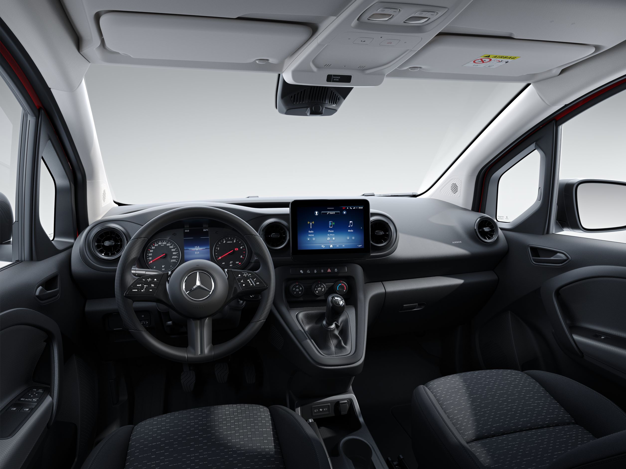 Citan Functionality | Mercedes-Benz Vans A person's hand operating the touchscreen of the MBUX multimedia system in the Mercedes-Benz Citan.