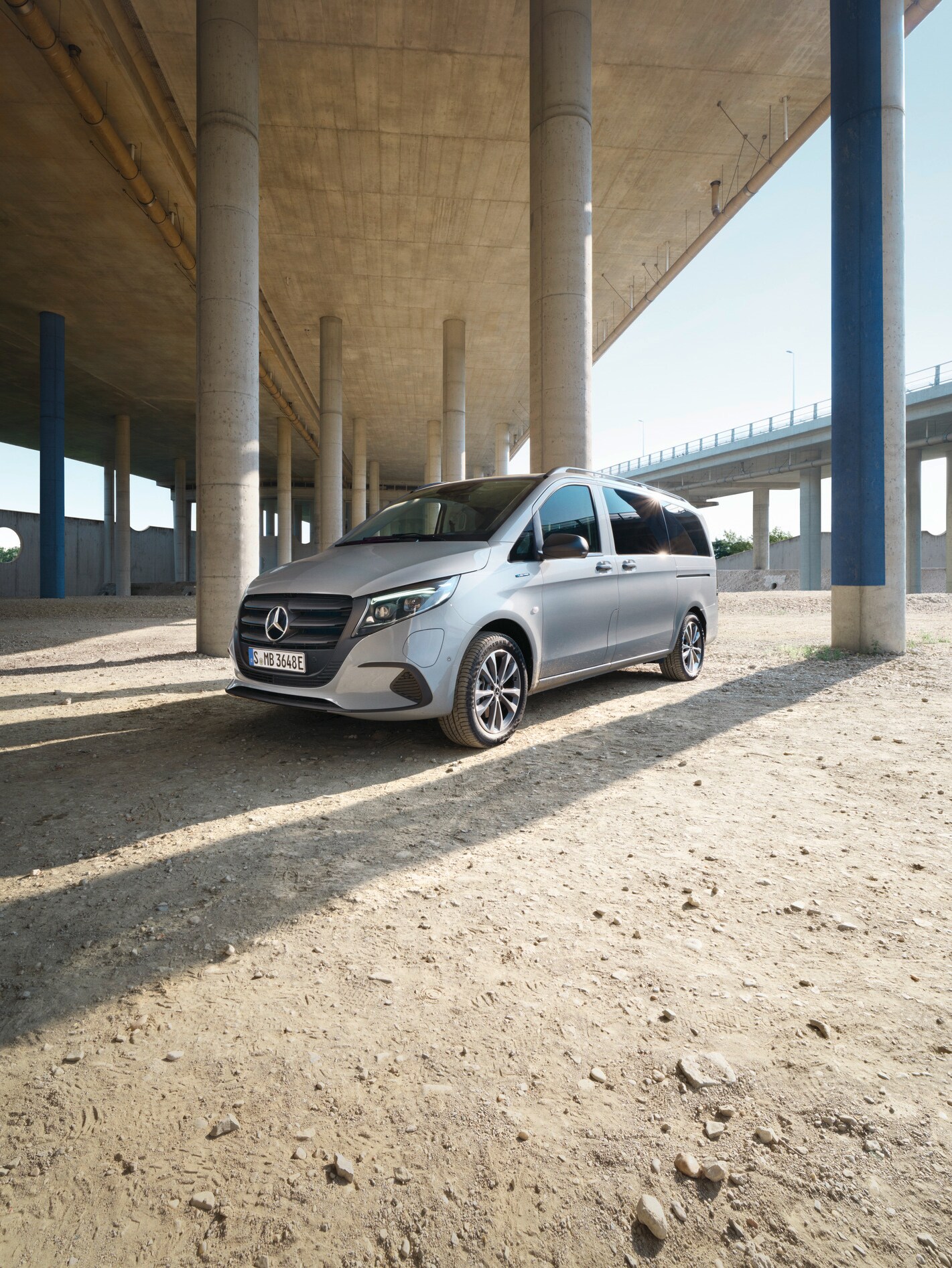 The eVito Tourer standing under a bridge.
