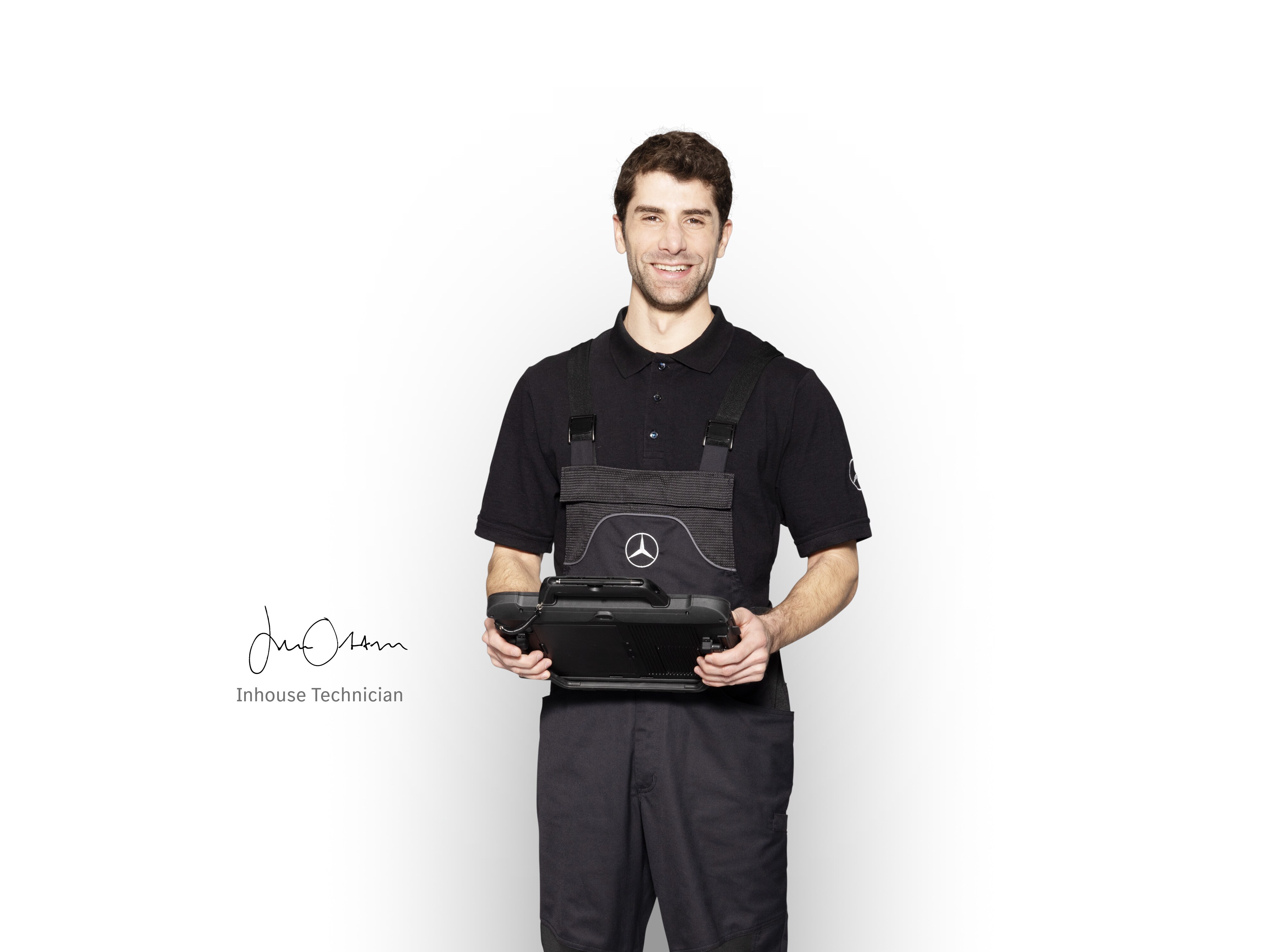 Inhouse Technician in workwear with tablet in his hands to ensure the best quality is delivered.