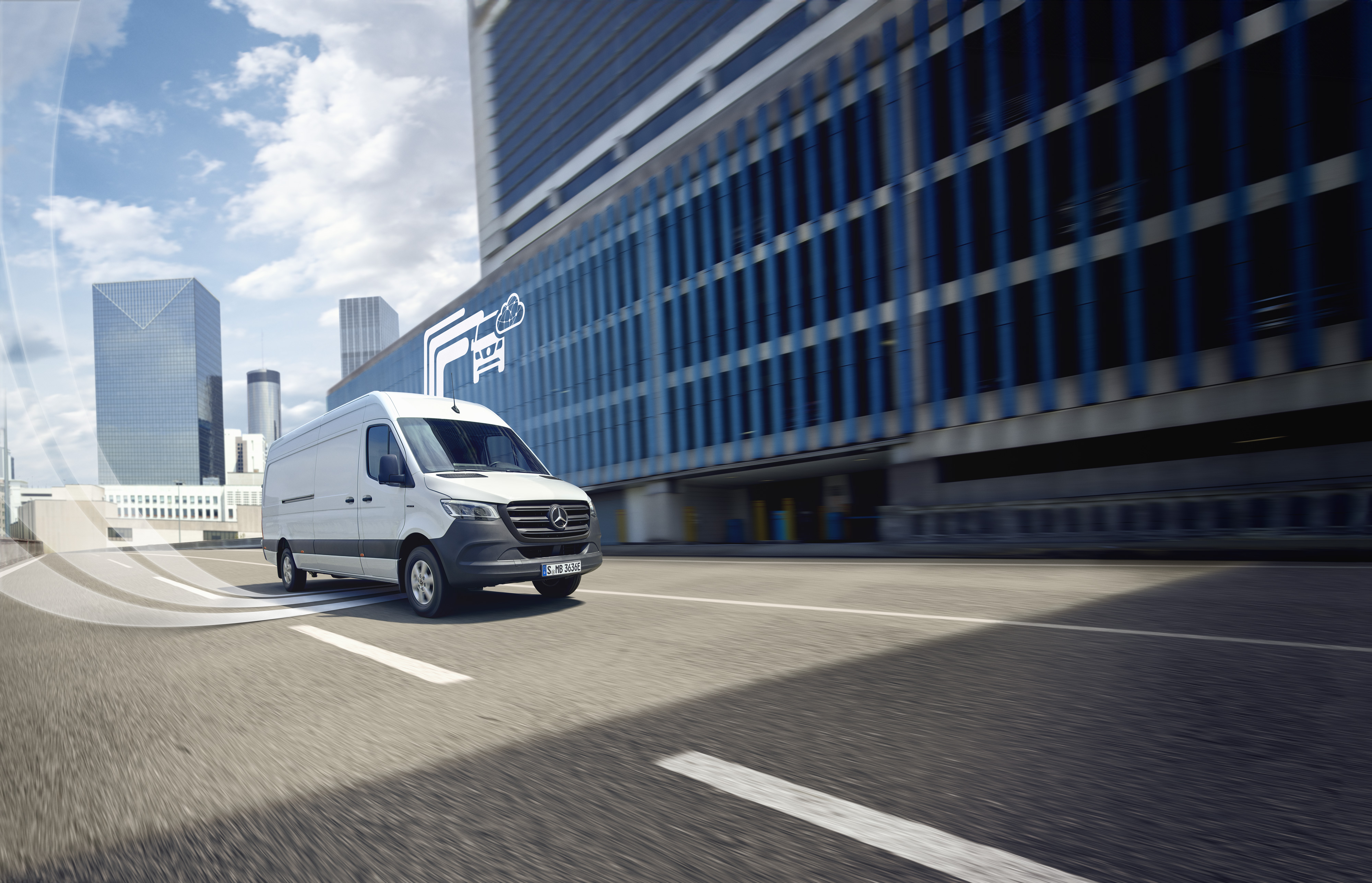 Mercedes-Benz | Van technology | Digital Extras Mercedes-Benz van driving against a modern backdrop, digital mercedes benz technology is visualised.