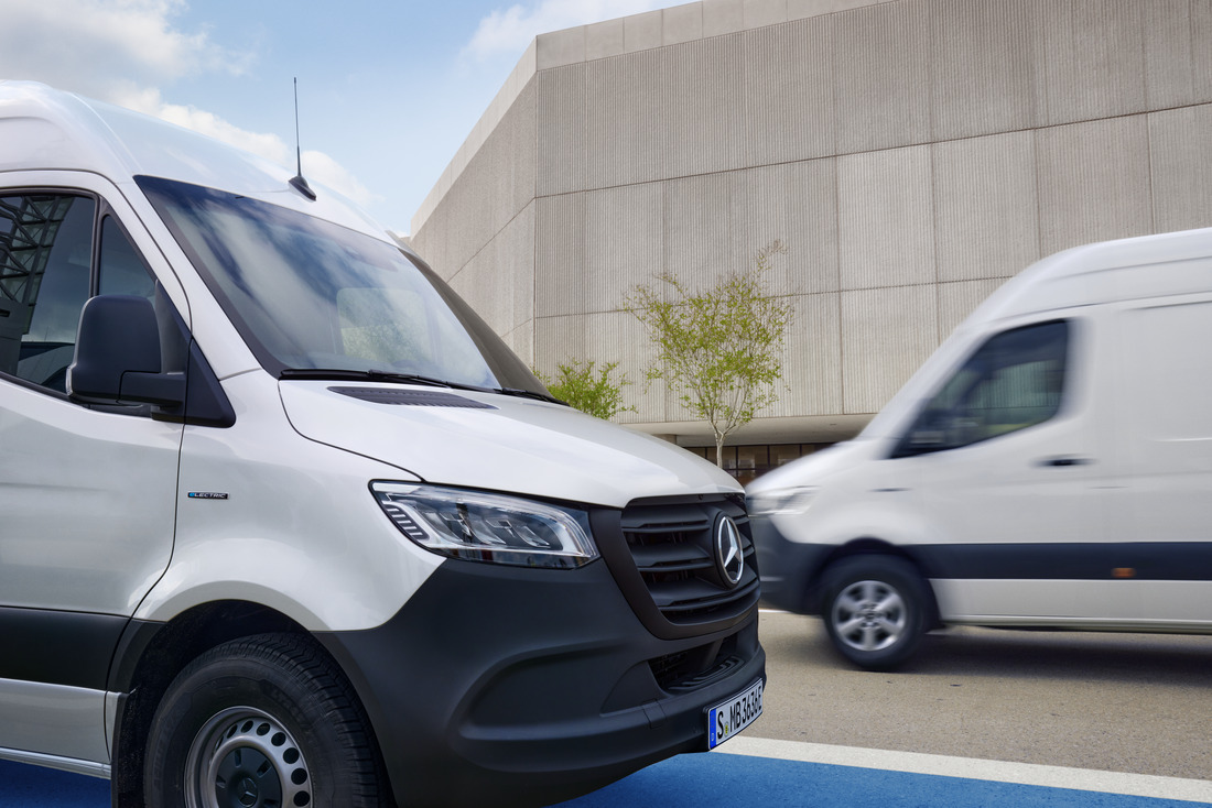 Sprinter Vans on the Move | Mercedes-Benz Vans Two white Mercedes-Benz Sprinter vans on the move.